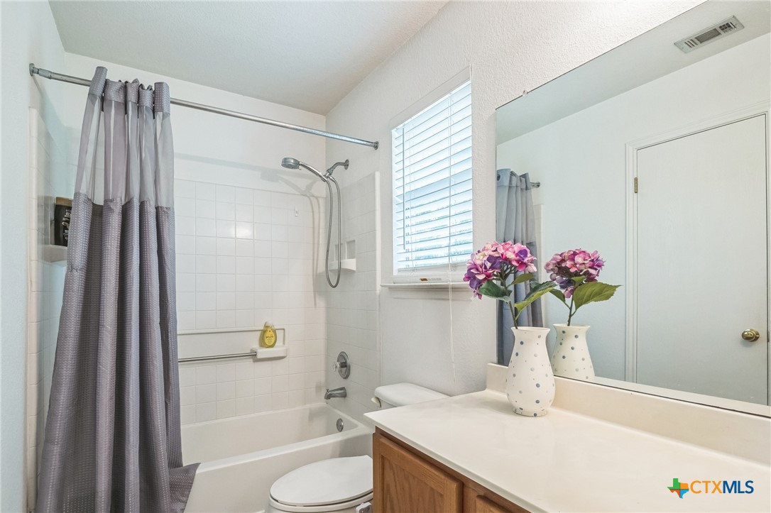 101 Cannery Cove Leander, TX 78641 - Photo 23 of 40 a bath room with a sink and a bath tub