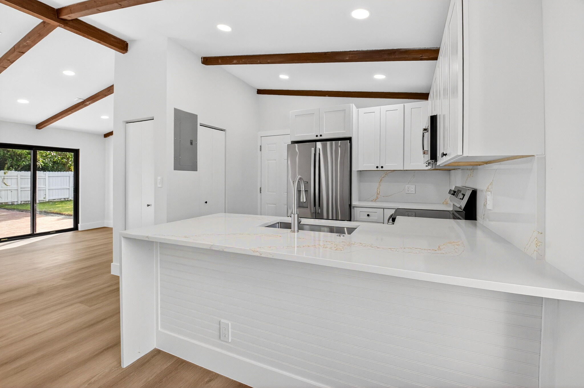 10151 Windtree Lane Boca Raton, FL 33428 - Photo 15 of 39 a view of kitchen with stainless steel appliances cabinets and wooden floor