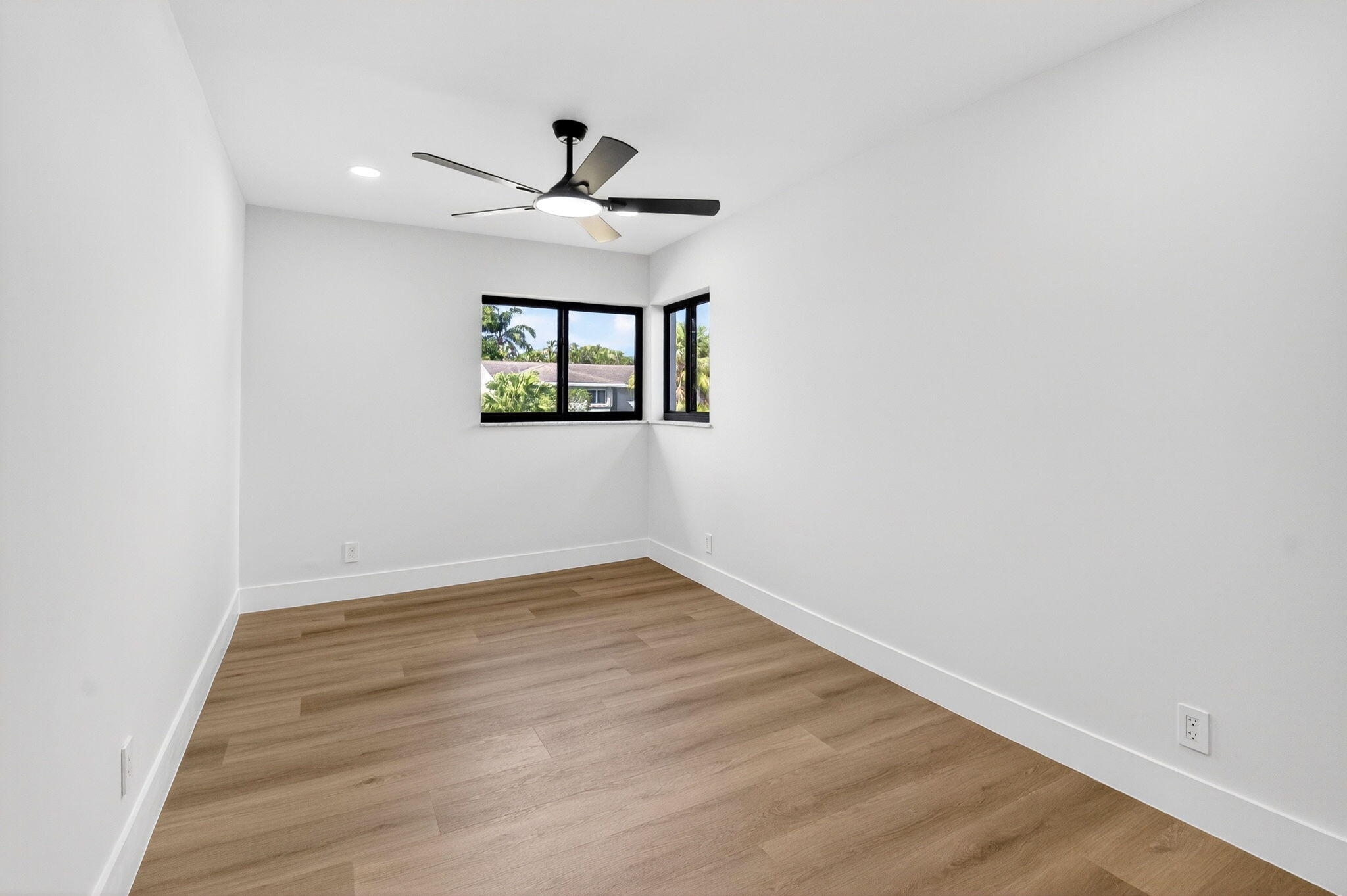 10151 Windtree Lane Boca Raton, FL 33428 - Photo 18 of 39 a view of empty room with wooden floor