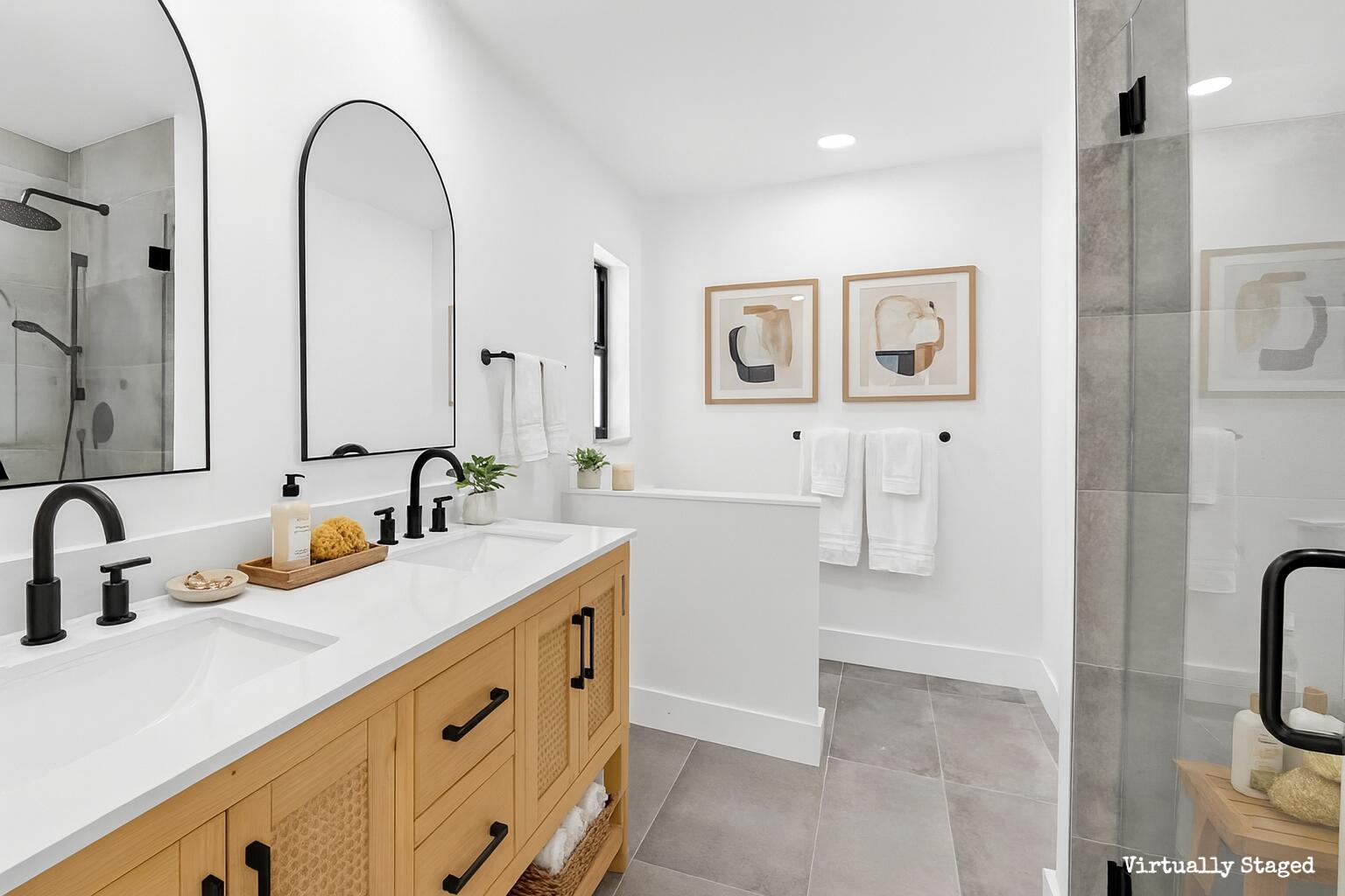 10151 Windtree Lane Boca Raton, FL 33428 - Photo 25 of 39 a bathroom with a double vanity sink a mirror and a shower
