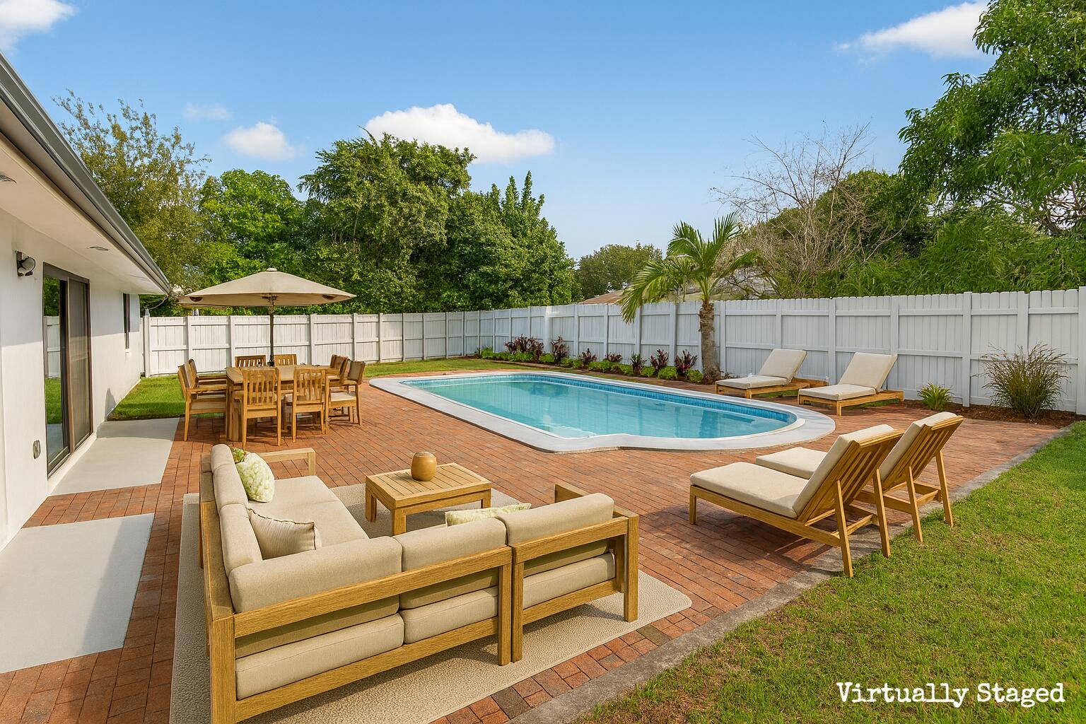 10151 Windtree Lane Boca Raton, FL 33428 - Photo 31 of 39 a view of a swimming pool with lounge chairs