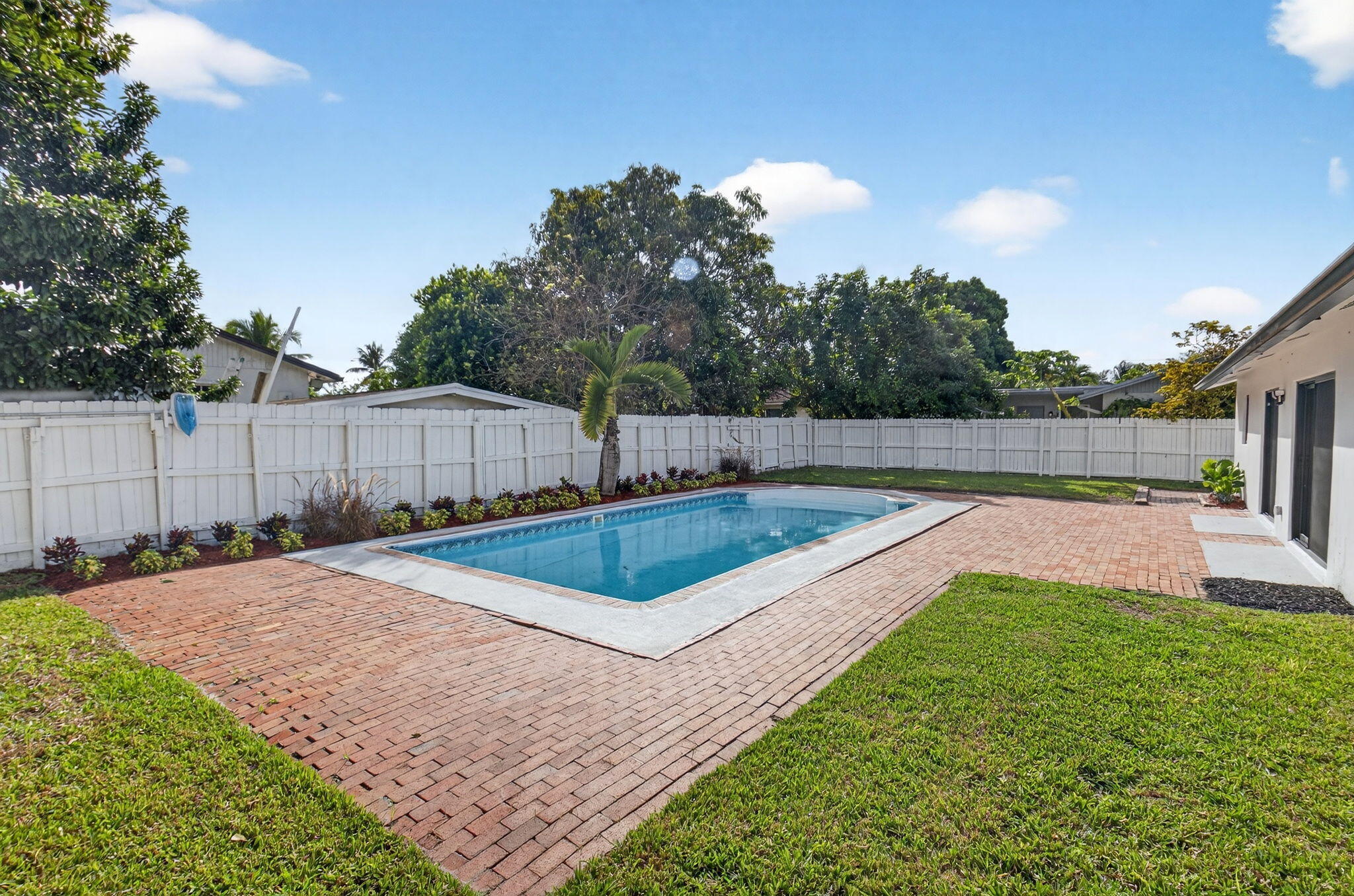 10151 Windtree Lane Boca Raton, FL 33428 - Photo 33 of 39 a view of a backyard with a trampoline