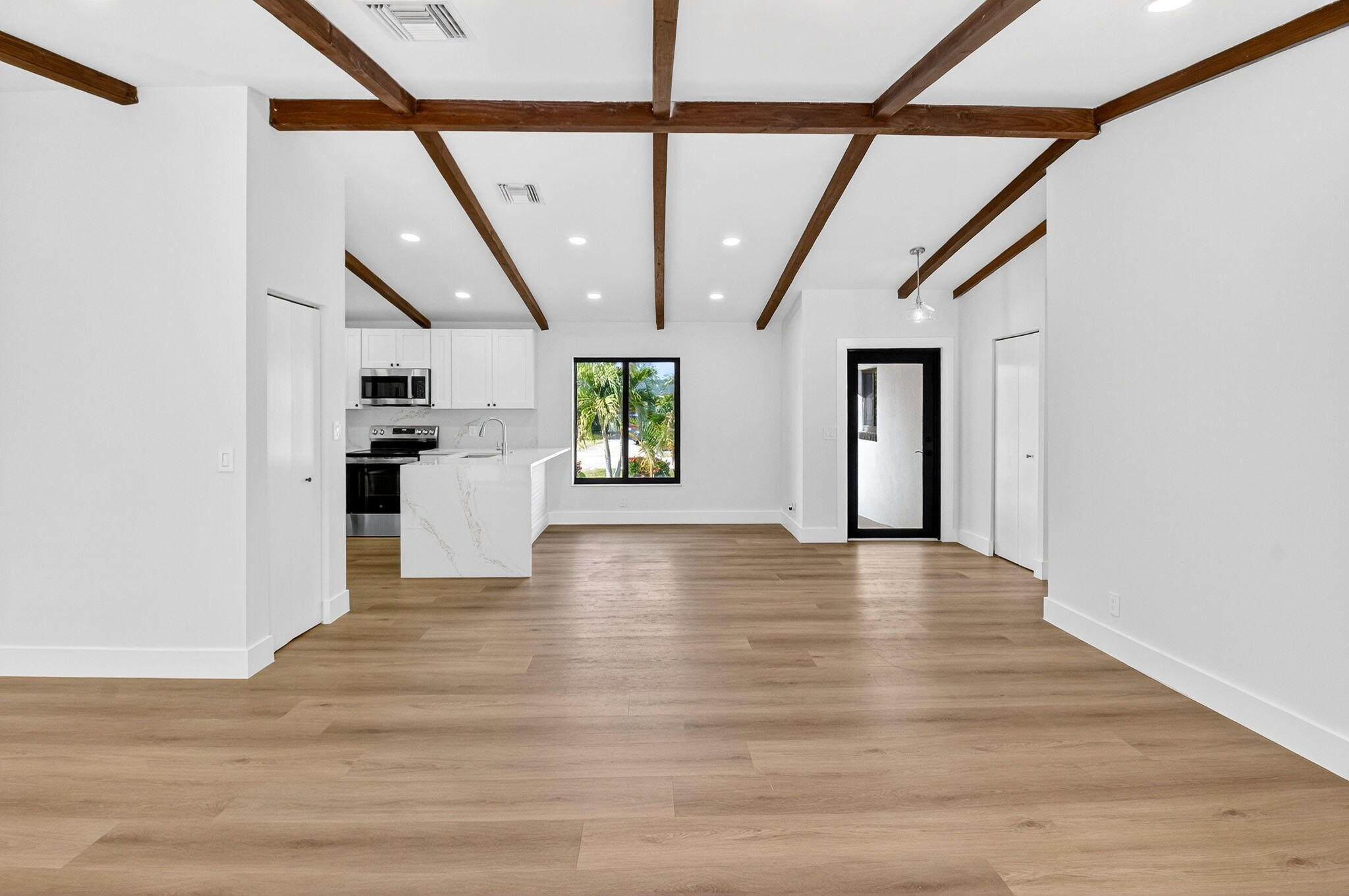 10151 Windtree Lane Boca Raton, FL 33428 - Photo 10 of 39 a view of an entryway with wooden floor