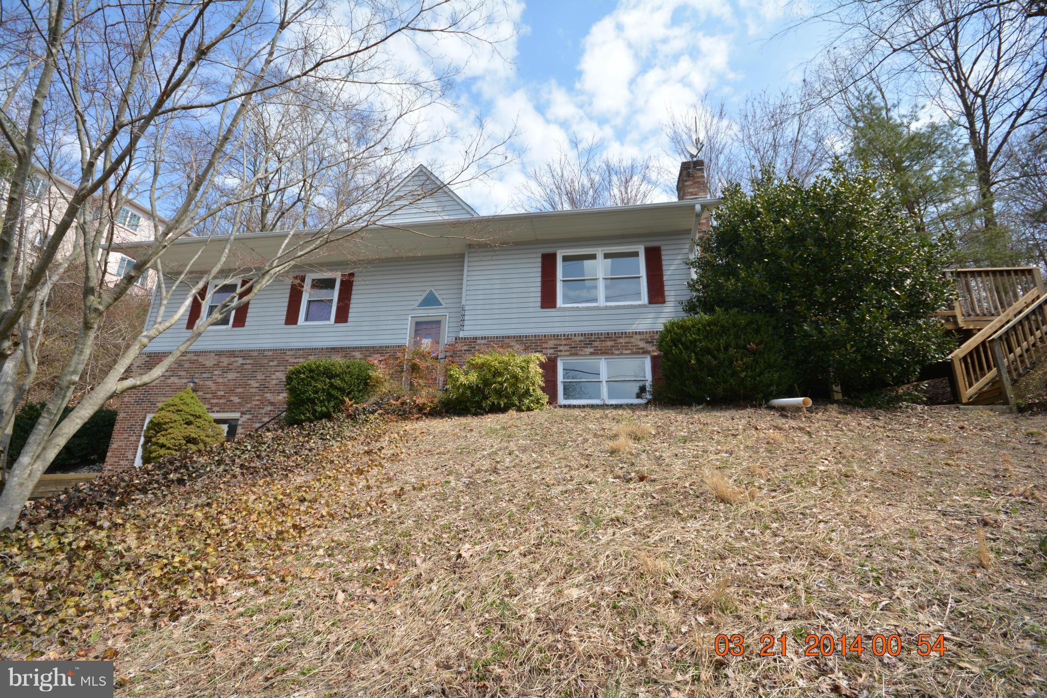 18069 Possum Point Road Dumfries, VA 22026 - Photo 22 of 22 a front view of a house with a yard and garage