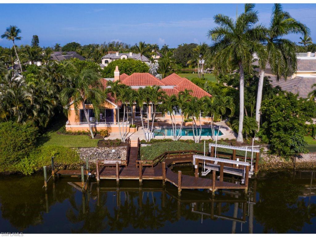 3275 Gin Lane Naples, FL 34102 - Photo 12 of 13 a view of a chairs and table in backyard