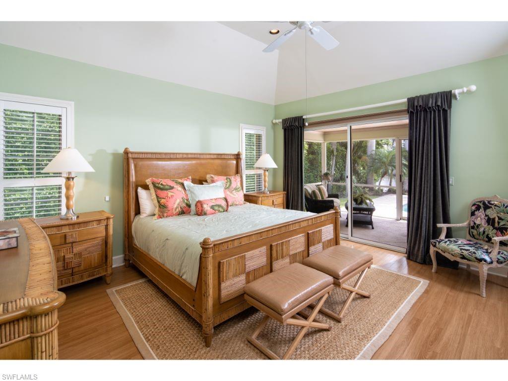 3275 Gin Lane Naples, FL 34102 - Photo 7 of 13 a bedroom with furniture and a large window