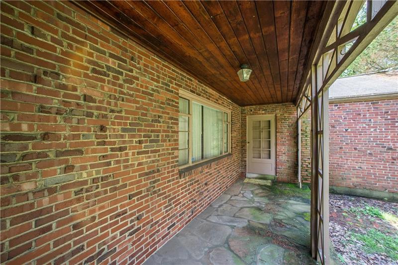 359 Beadling Road Pittsburgh, PA 15228 - Photo 2 of 25 The covered front porch has a stone floor and a door that enters directly to the living room.