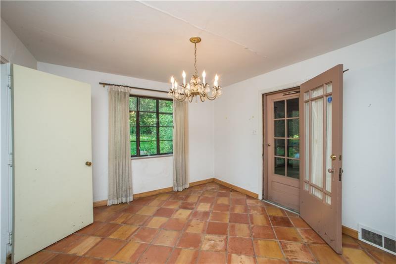 359 Beadling Road Pittsburgh, PA 15228 - Photo 5 of 25 A closer look into the dining room reveals a lovely wood and glass access door (center, right) leading to the rear screened, covered patio. The door opposite that (left of photo) leads to the kitchen.