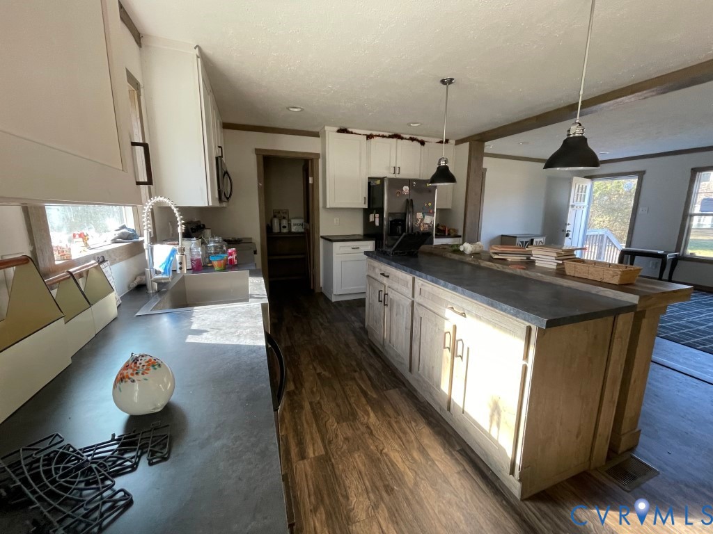 97 Buster Lane West Point, VA 23181 - Photo 12 of 32 a kitchen with a stove and a refrigerator
