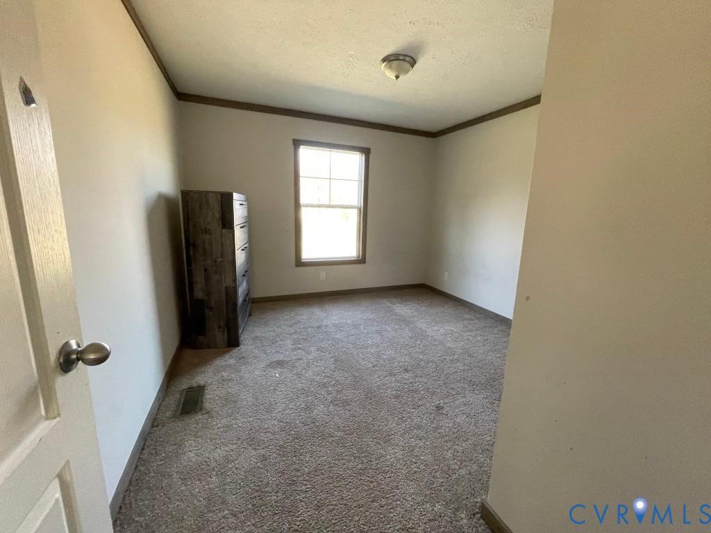 97 Buster Lane West Point, VA 23181 - Photo 17 of 32 an empty room with windows