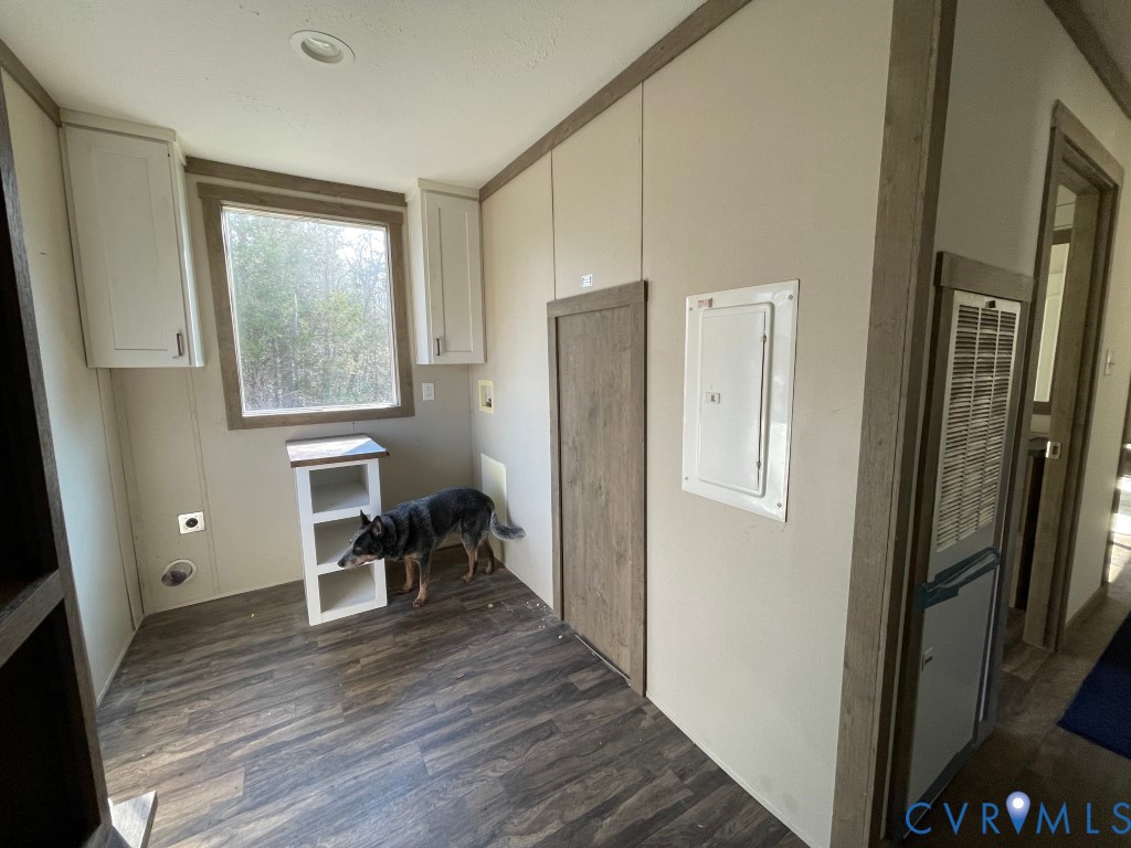 97 Buster Lane West Point, VA 23181 - Photo 19 of 32 a view of a hallway with wooden floor and furniture