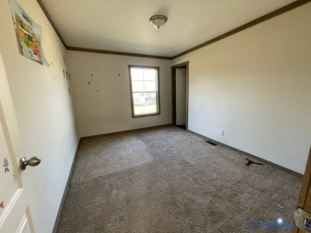 97 Buster Lane West Point, VA 23181 - Photo 21 of 32 a view of an empty room with a window