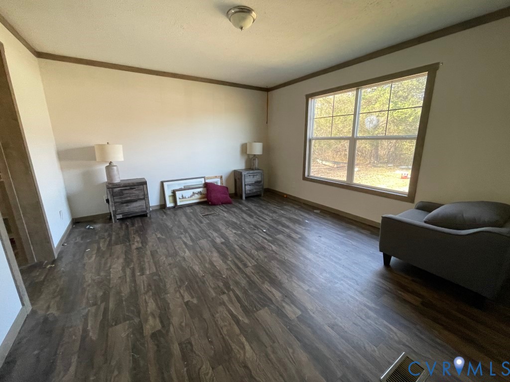 97 Buster Lane West Point, VA 23181 - Photo 24 of 32 a living room with furniture and a wooden floor