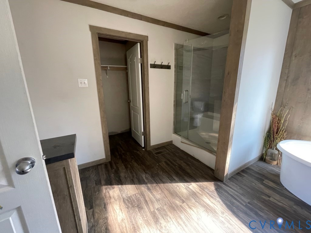 97 Buster Lane West Point, VA 23181 - Photo 27 of 32 a view of a closet with wooden floor