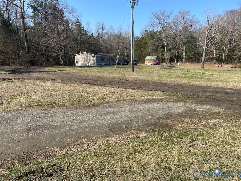 97 Buster Lane West Point, VA 23181 - Photo 31 of 32 a view of a field with trees in the background