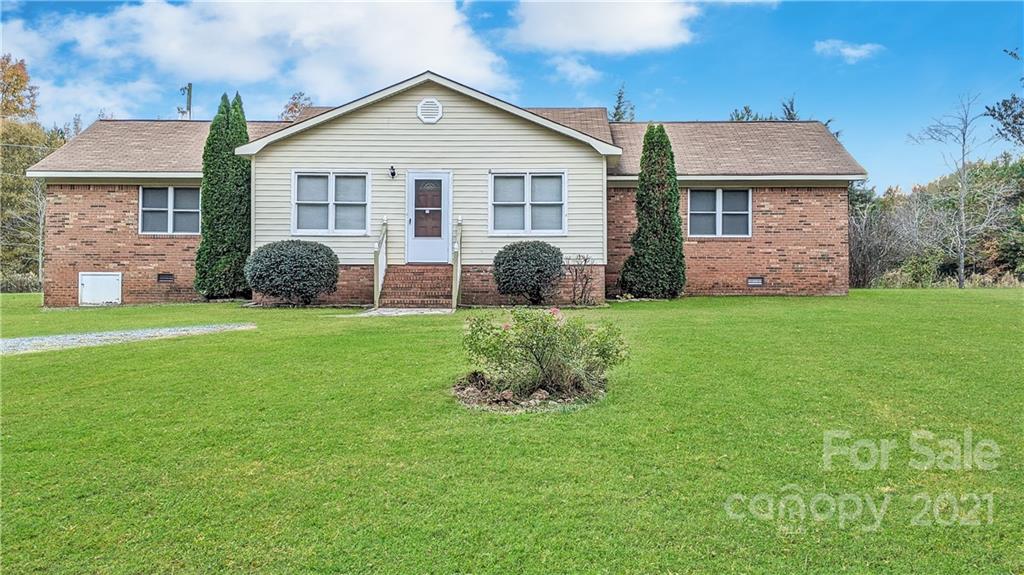 4020 Richardson Road Monroe, NC 28112 - Photo 1 of 18 a front view of a house with a yard and garage