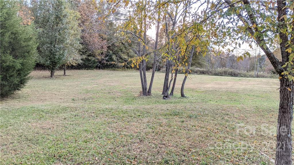 4020 Richardson Road Monroe, NC 28112 - Photo 17 of 18 a view of a field with trees in the background