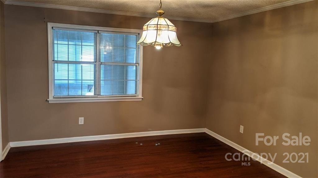 4020 Richardson Road Monroe, NC 28112 - Photo 5 of 18 a view of empty room with wooden floor and fan