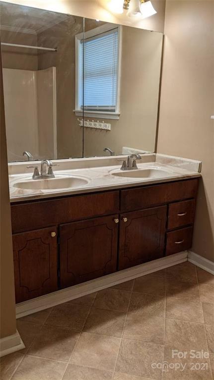 4020 Richardson Road Monroe, NC 28112 - Photo 7 of 18 a bathroom with a sink and a mirror