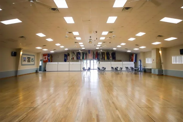 a view of a room with gym equipment and pool table
