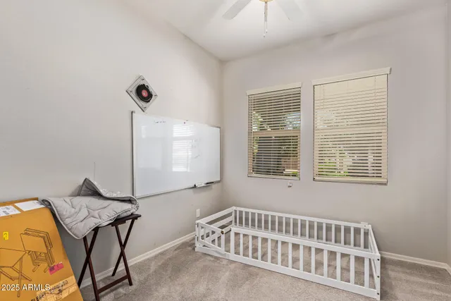 a bedroom with furniture and window