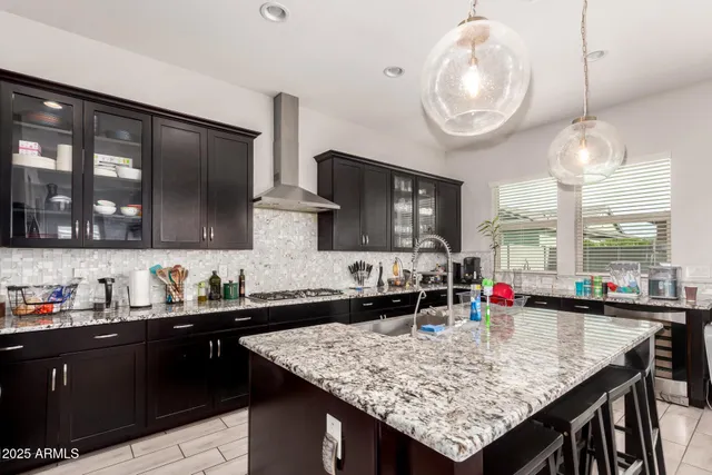 a kitchen with a counter space a sink and cabinets