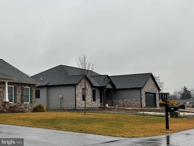 a front view of a house with swimming pool
