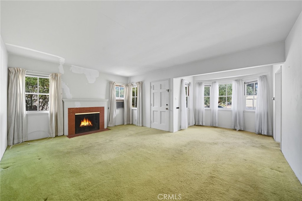 978 West Lehigh Street Altadena, CA 91001 - Photo 28 of 49 an empty room with windows and fireplace