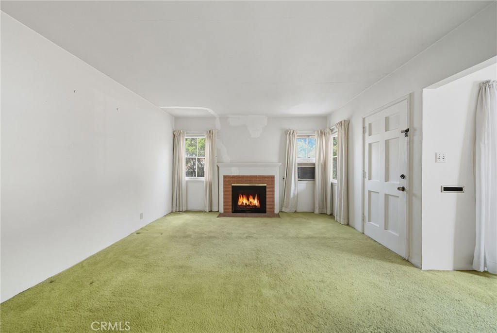978 West Lehigh Street Altadena, CA 91001 - Photo 30 of 49 a view of an empty room with a window and fireplace