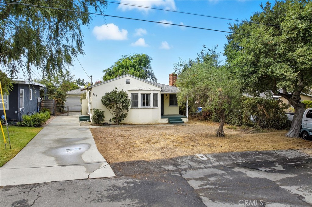 978 West Lehigh Street Altadena, CA 91001 - Photo 3 of 49 a front view of a house with a yard and garage