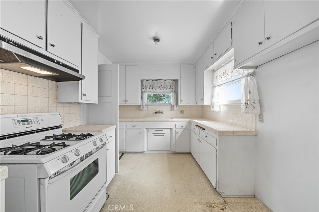 978 West Lehigh Street Altadena, CA 91001 - Photo 38 of 49 a kitchen with granite countertop cabinets and steel stainless steel appliances