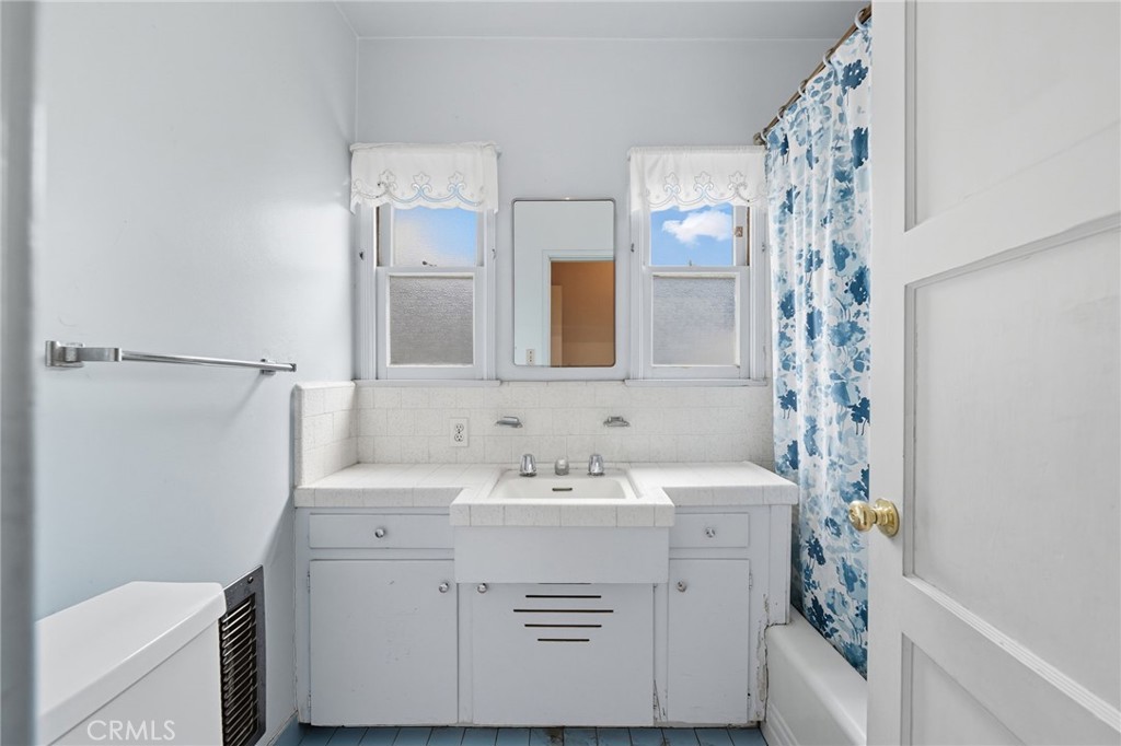 978 West Lehigh Street Altadena, CA 91001 - Photo 42 of 49 a bathroom with a sink a vanity and a mirror