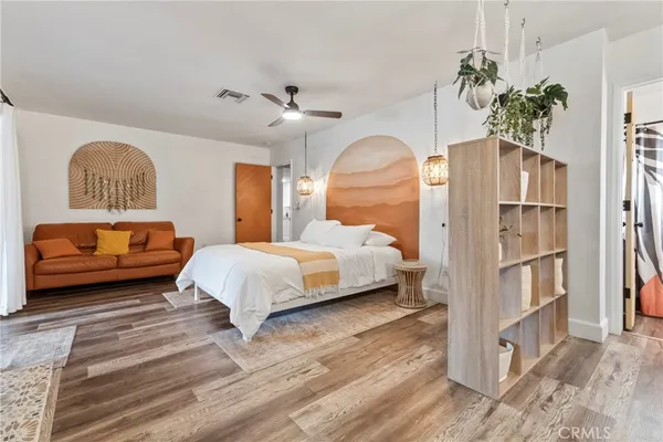 a bedroom with a bed and a fireplace