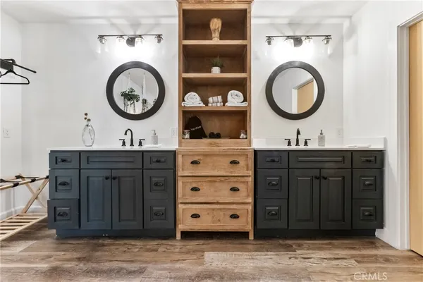 a bathroom with a toilet a sink and a mirror