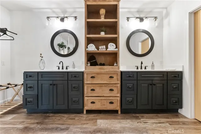 a bathroom with a toilet a sink and a mirror