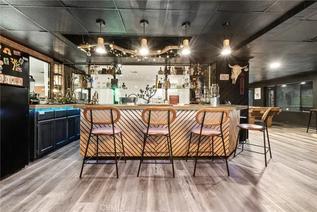 a living room with lots of furniture and a chandelier
