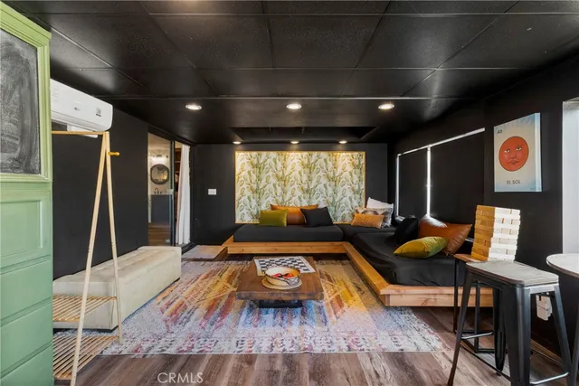 a living room with furniture and a rug