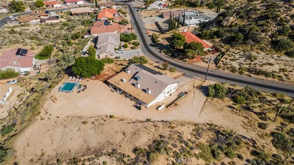 an aerial view of house with a yard
