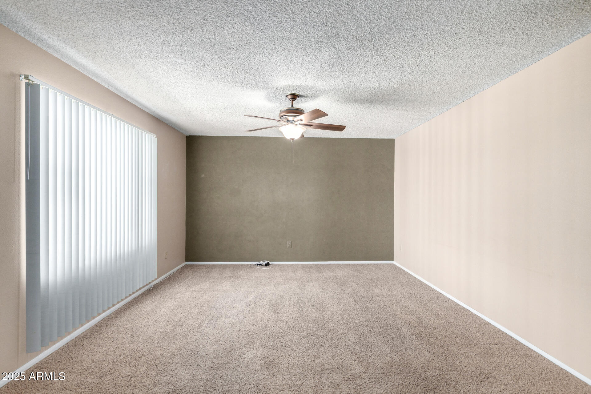4740 West Bloomfield Road Glendale, AZ 85304 - Photo 6 of 34 a view of a livingroom with a chandelier fan