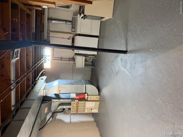 43038 Hanford Road Canton, MI 48187 - Photo 32 of 36 Utility space featuring a concrete floor, exposed ceiling joists, and a small egress window