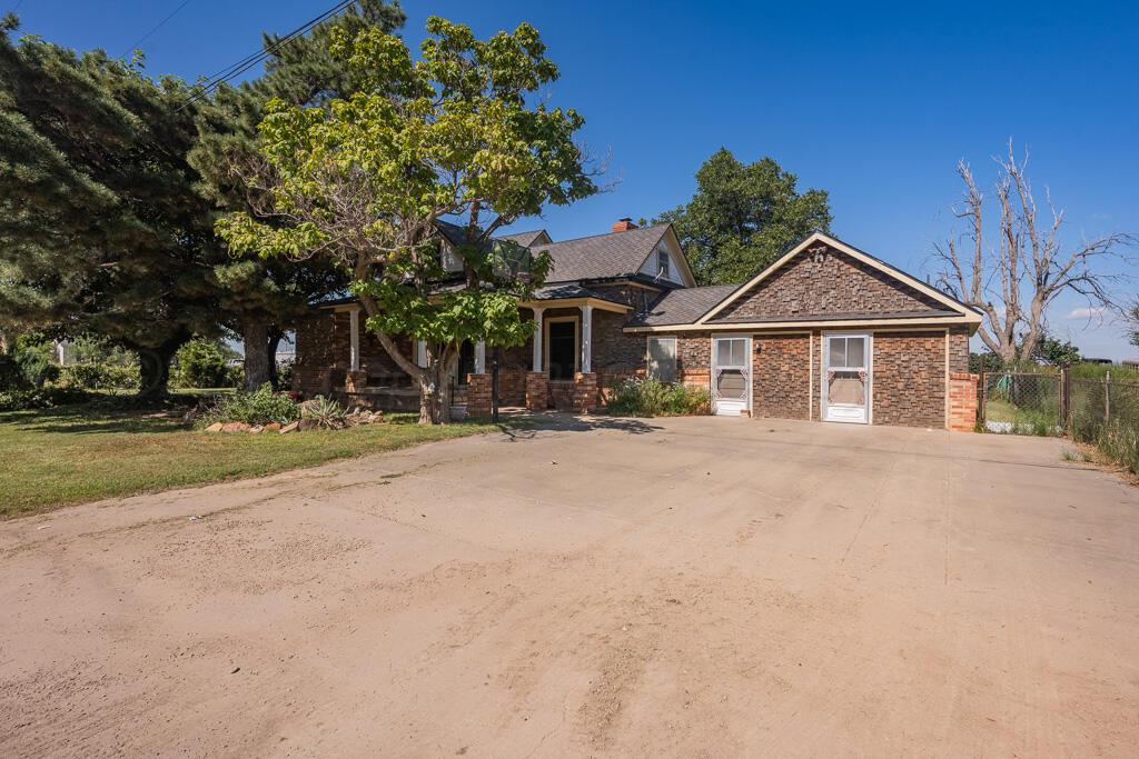 404 Chester Avenue Panhandle, TX 79068 - Photo 1 of 33 a front view of a house with a yard