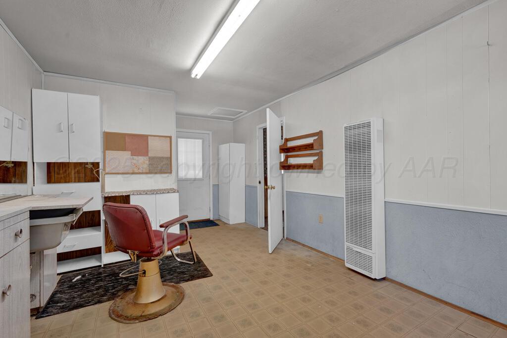 404 Chester Avenue Panhandle, TX 79068 - Photo 11 of 33 a workspace with furniture and window
