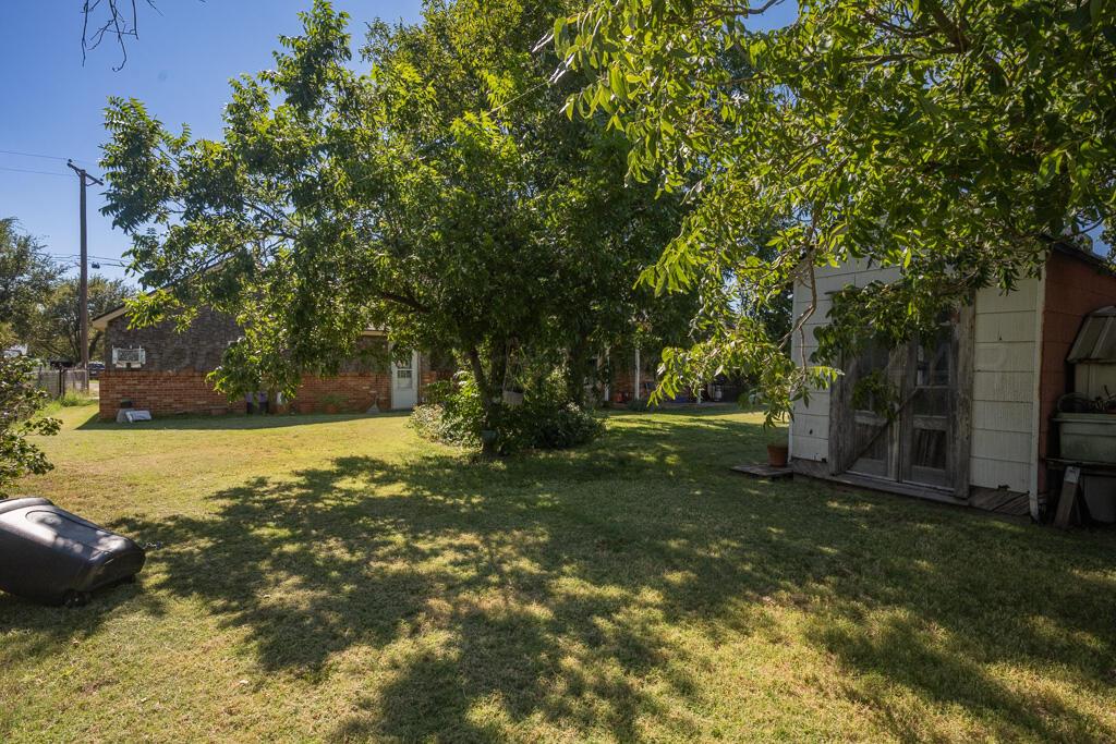 404 Chester Avenue Panhandle, TX 79068 - Photo 28 of 33 a view of a yard with swimming pool