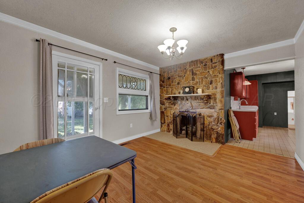 404 Chester Avenue Panhandle, TX 79068 - Photo 6 of 33 a view of a dining room with furniture and chandelier