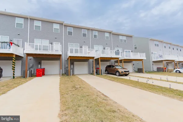 a view of a house with potted plants