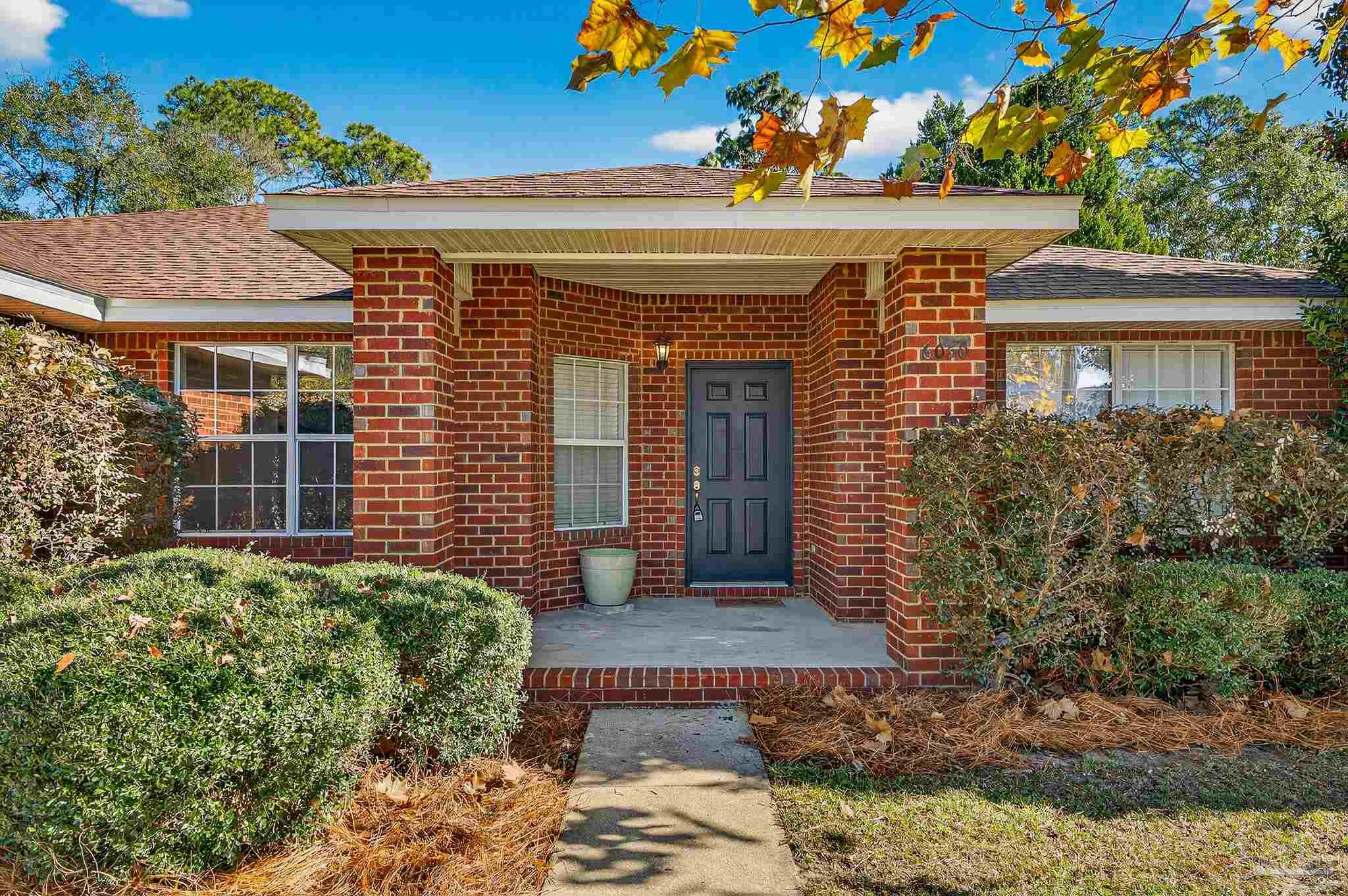 6050 Antelope Street Milton, FL 32570 - Photo 1 of 58 front view of a house with a small yard