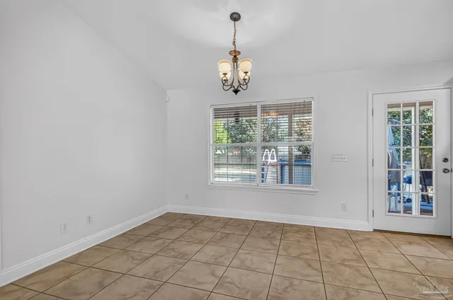 a view of an empty room with windows