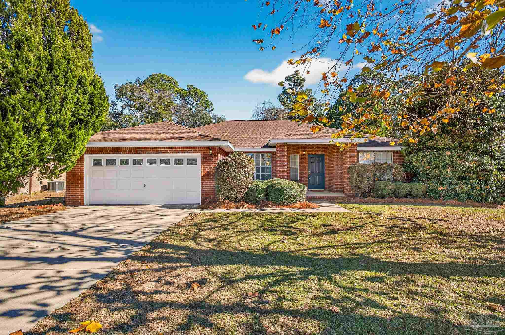 6050 Antelope Street Milton, FL 32570 - Photo 2 of 58 a front view of a house with a yard