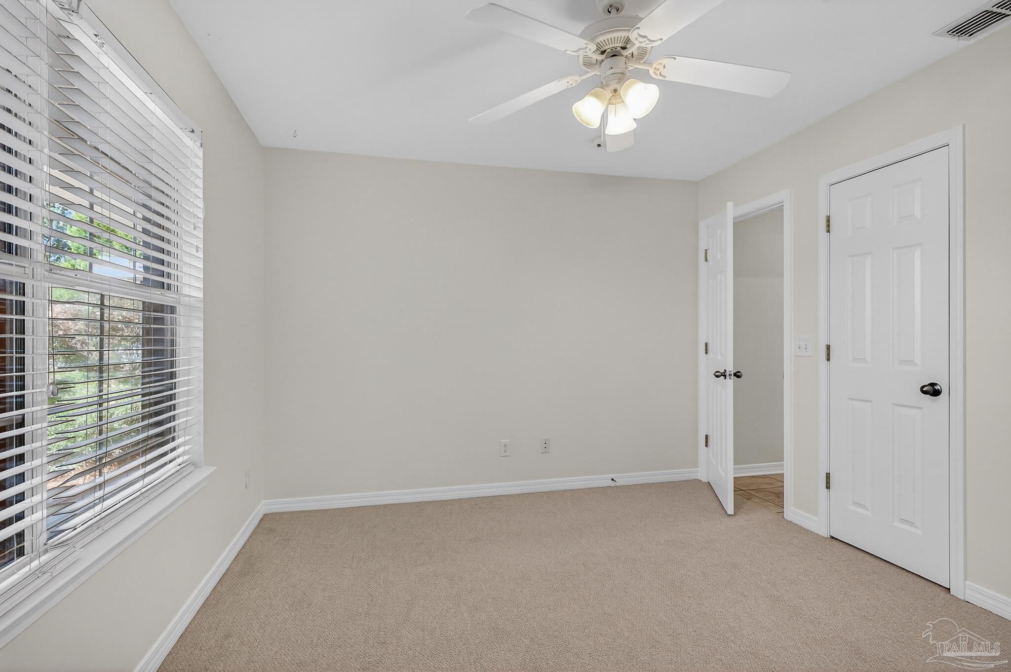 6050 Antelope Street Milton, FL 32570 - Photo 26 of 58 a view of an empty room with a window