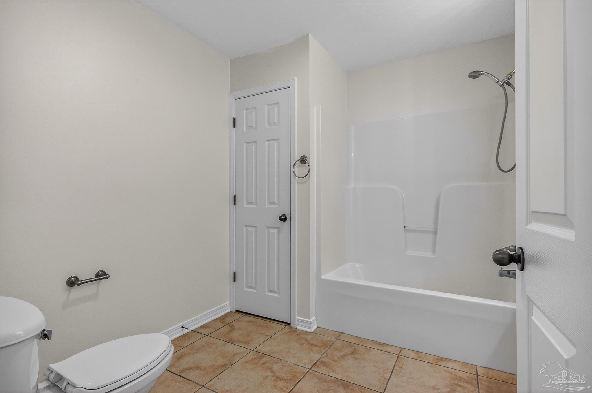 6050 Antelope Street Milton, FL 32570 - Photo 28 of 58 a bathroom with a granite countertop bathtub and toilet